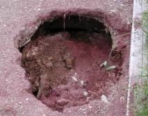 hole in earth above grave